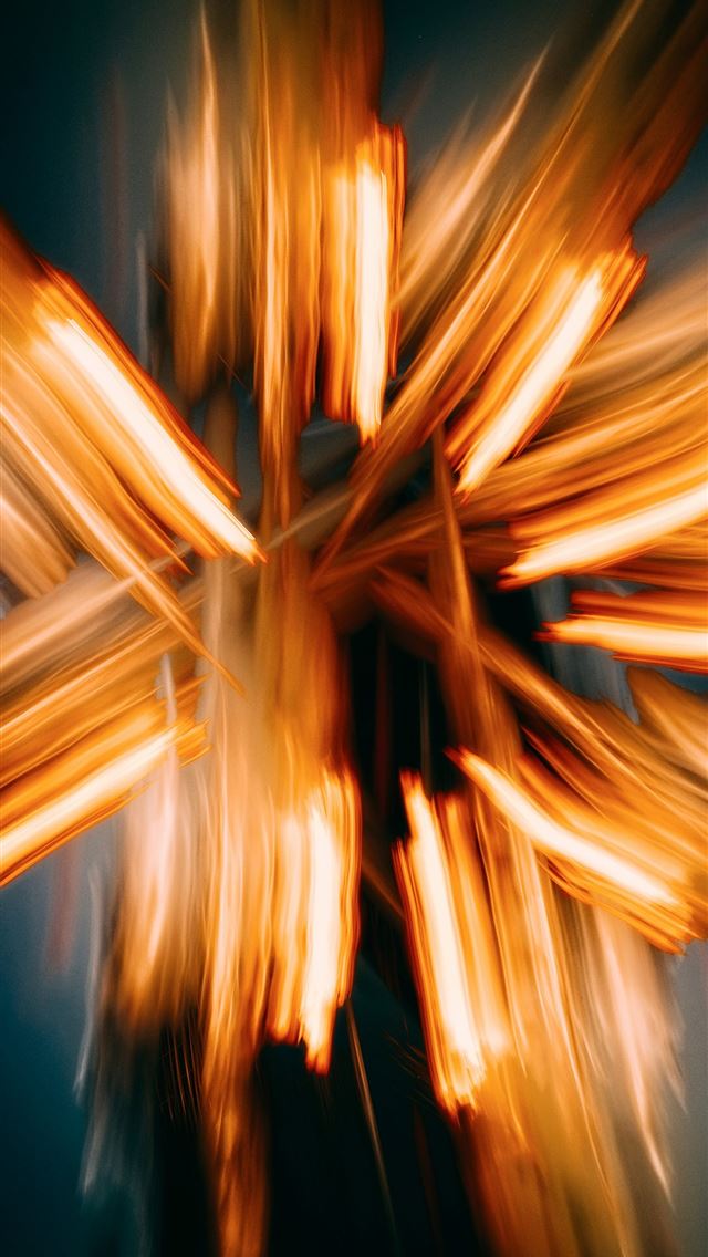 640x1136 A blurry photo of a cross made of wood -  iPhone Wallpaper