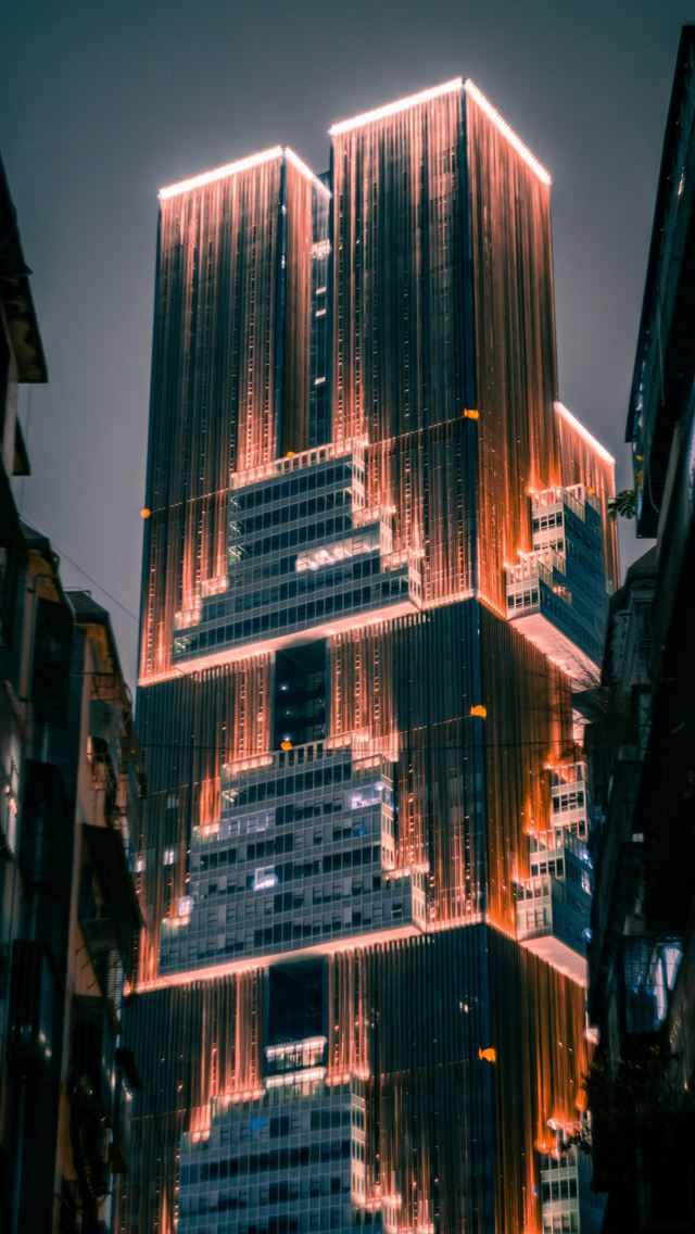 640x1136 a very tall building with a lot of lights on it -  iPhone Wallpaper