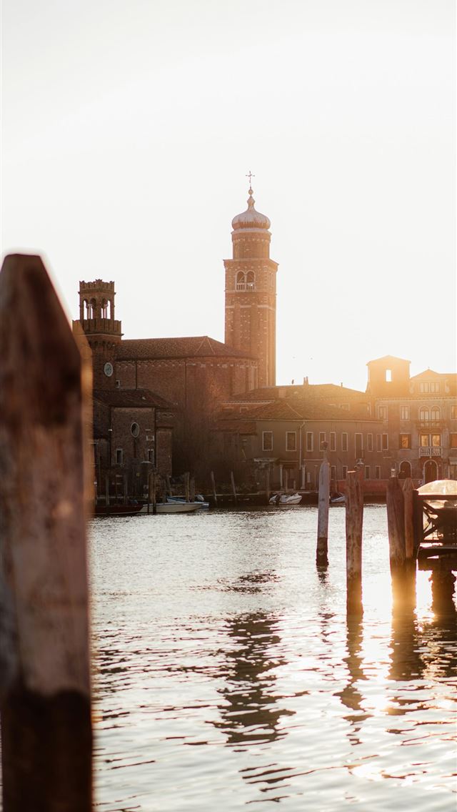 640x1136 A view of a body of water with a clock tower in th... -  iPhone Wallpaper