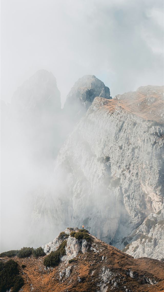 1290x2796 Misty mountains peeking through the clouds  -  iPhone Wallpaper
