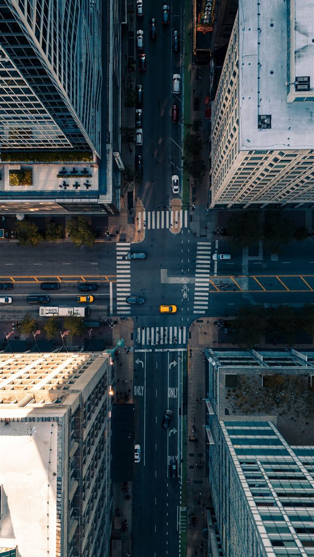 1290x2796 An aerial view of a city with tall buildings -  iPhone Wallpaper