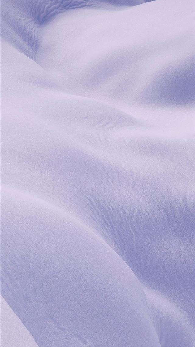 1290x2796 a person skiing down a snow covered slope -  iPhone Wallpaper