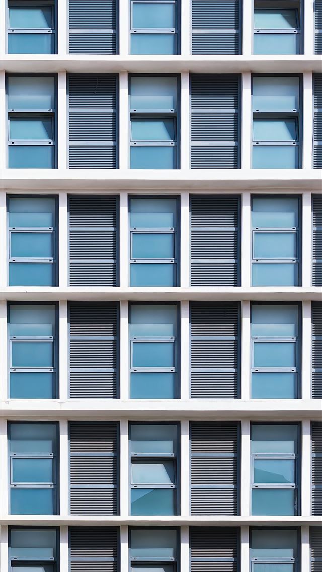 1290x2796 A tall white building with lots of windows -  iPhone Wallpaper
