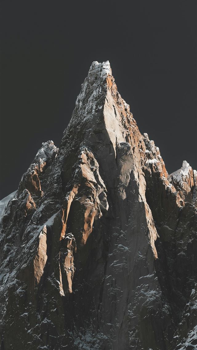 1290x2796 A snow covered mountain with a dark sky in the bac... -  iPhone Wallpaper