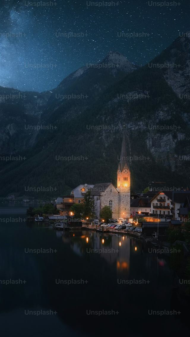 1290x2796 a night scene of a small town on a lake -  iPhone Wallpaper