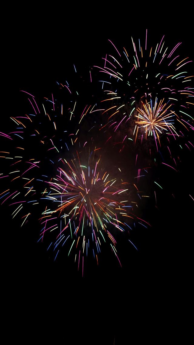 1290x2796 A fireworks display in the night sky -  iPhone Wallpaper
