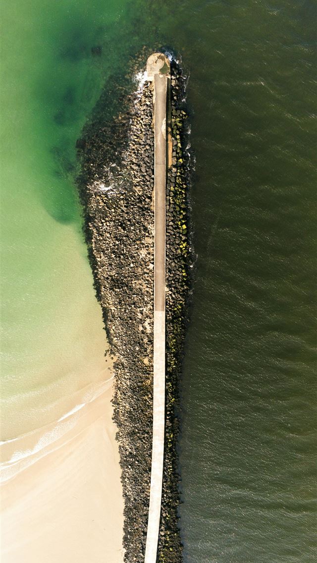 1290x2796 An aerial view of a pier in the water -  iPhone Wallpaper