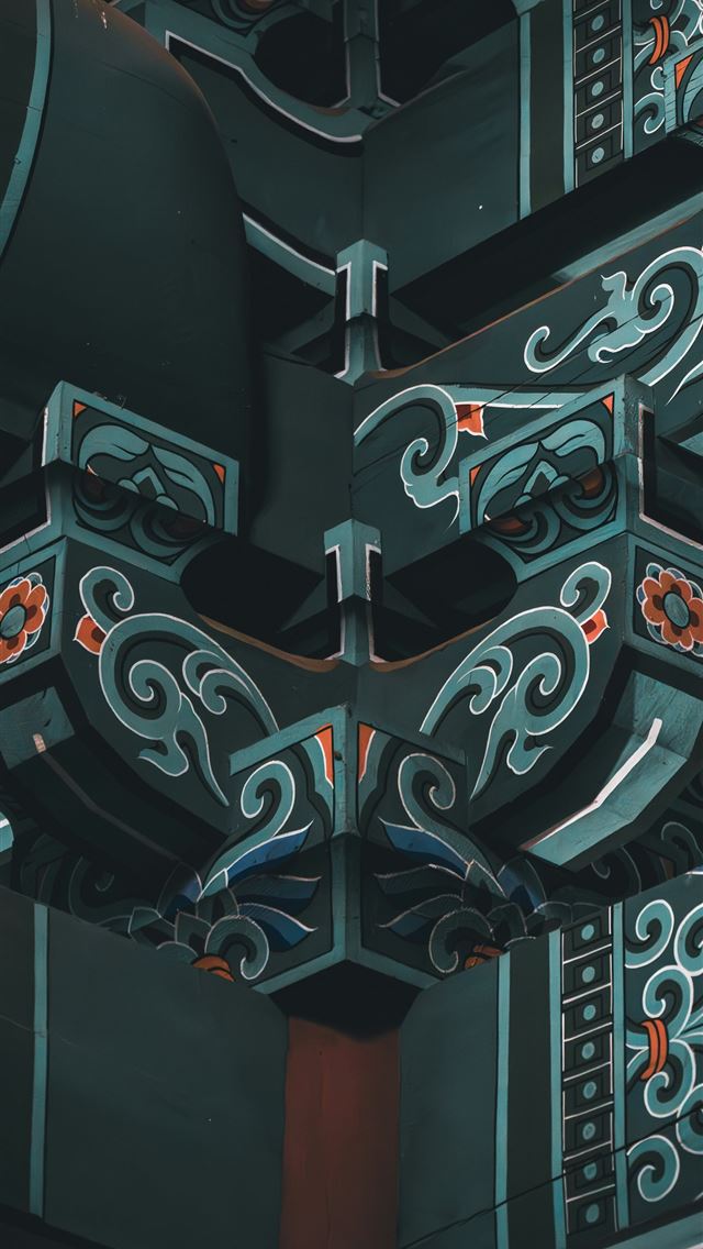 1290x2796 a close up of a metal structure with designs on it -  iPhone Wallpaper