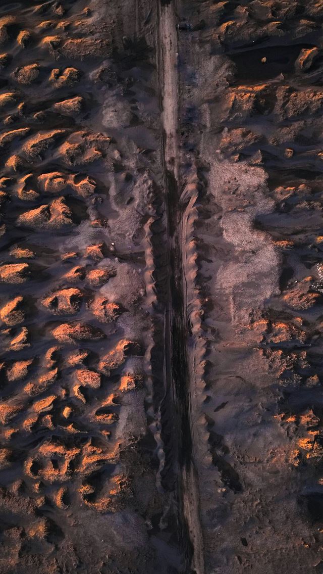 1290x2796 An aerial view of a long straight road  -  iPhone Wallpaper