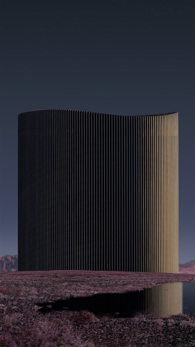 1290x2796 A tall tower sitting in the middle of a desert -  iPhone Wallpaper