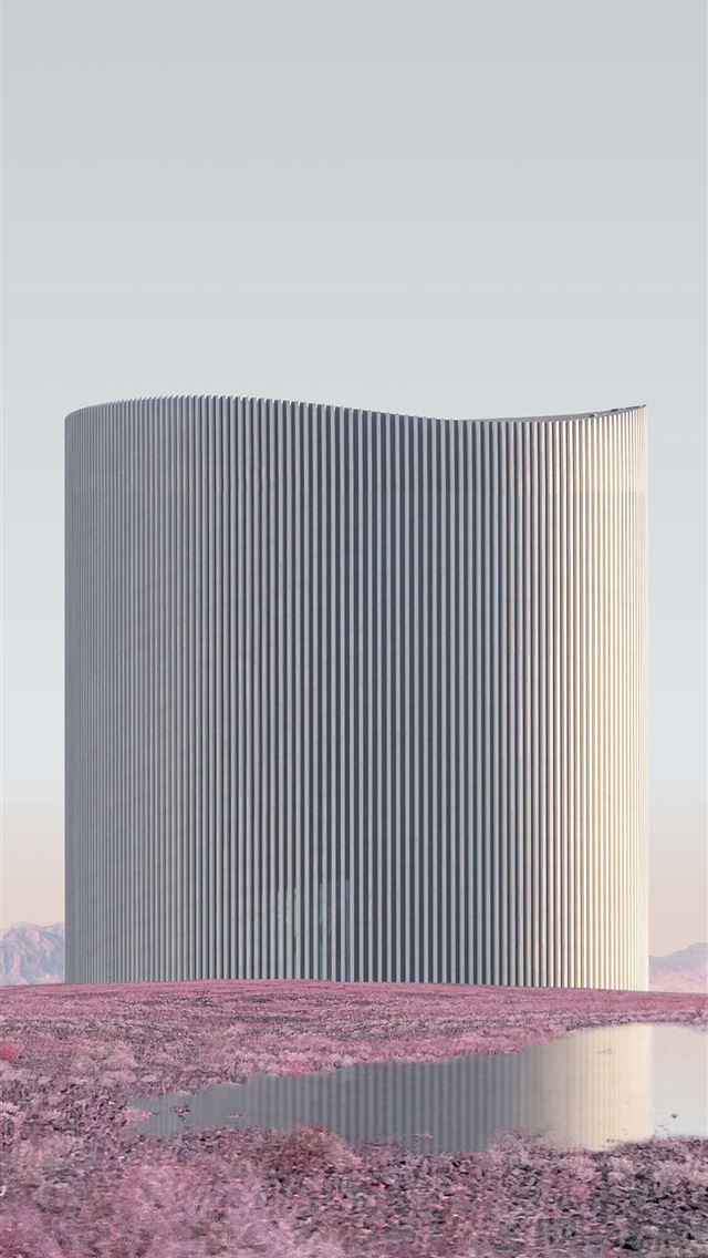 1290x2796 A tall white building sitting in the middle of a d... -  iPhone Wallpaper