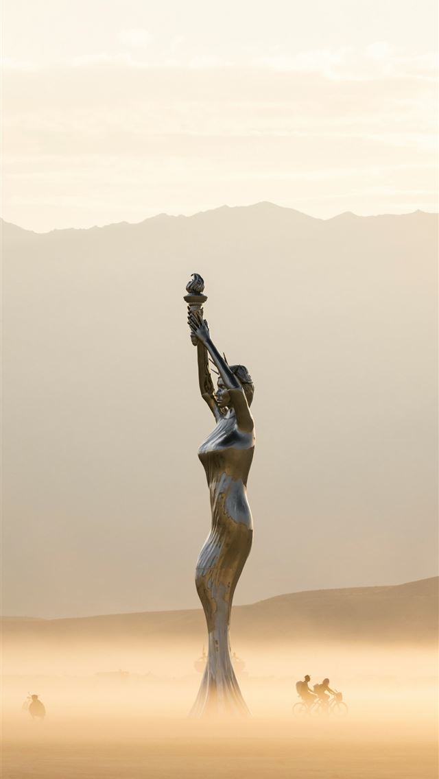 1290x2796 A statue in the middle of a desert with mountains ... -  iPhone Wallpaper