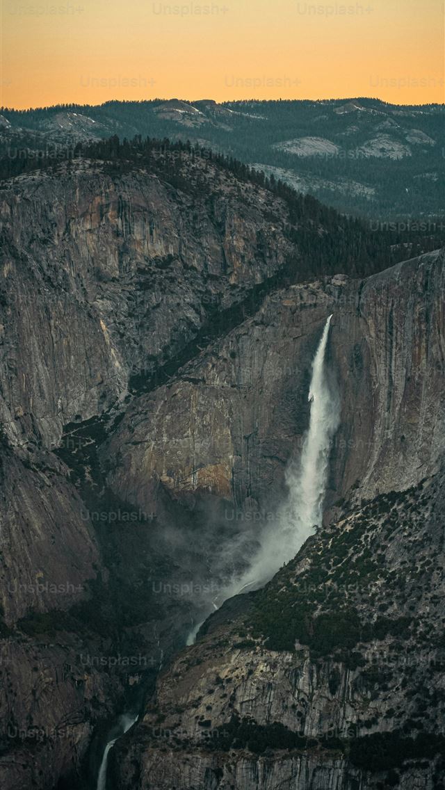 1290x2796 a view of a waterfall from a high point of view -  iPhone Wallpaper