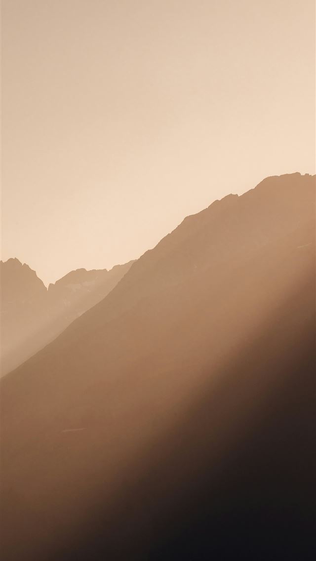 1290x2796 Sunlight streams over majestic mountains  -  iPhone Wallpaper
