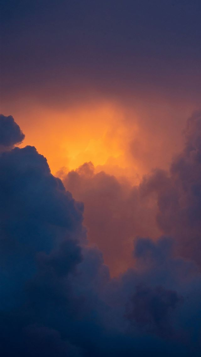 1290x2796 A plane flying through a cloudy sky at sunset -  iPhone Wallpaper