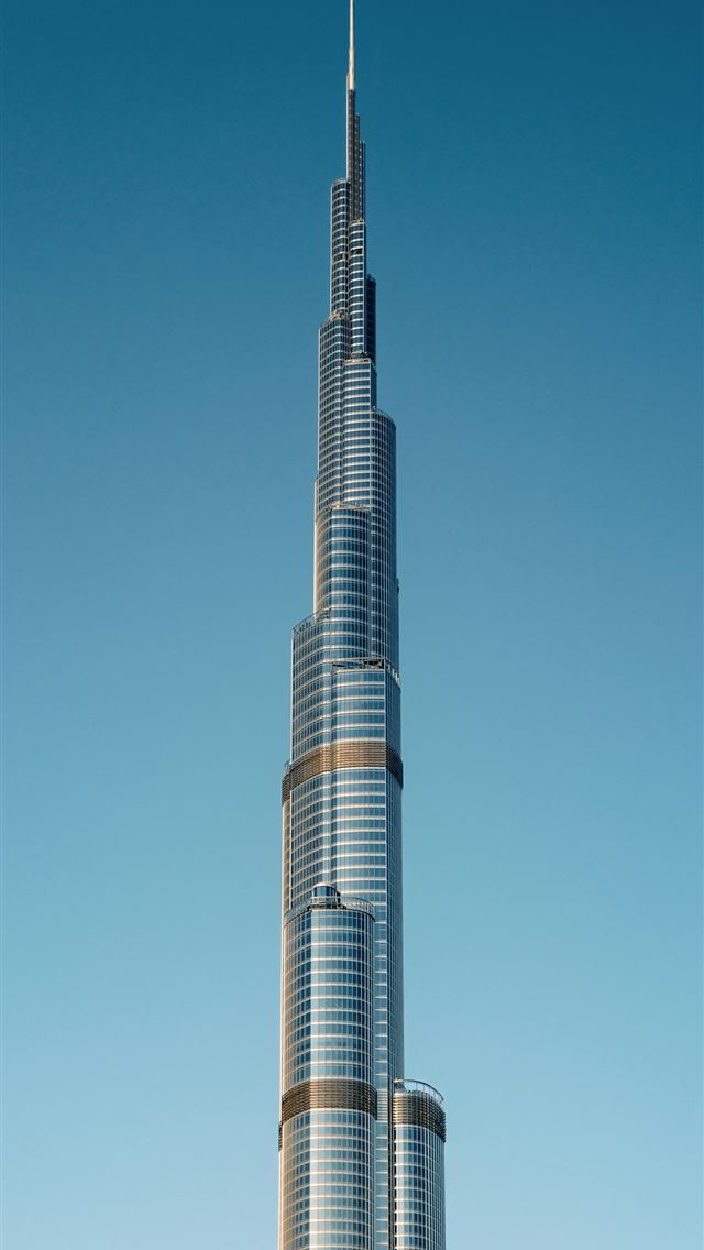 1290x2796 The burj building in the middle of the city -  iPhone Wallpaper