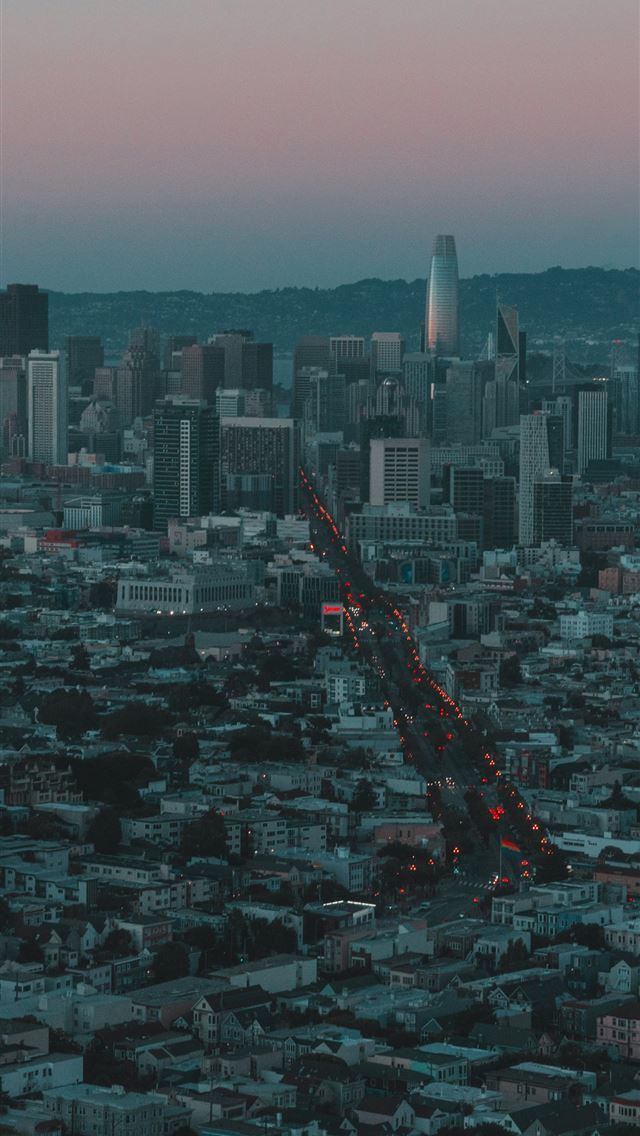 1290x2796 An aerial view of a city at dusk -  iPhone Wallpaper