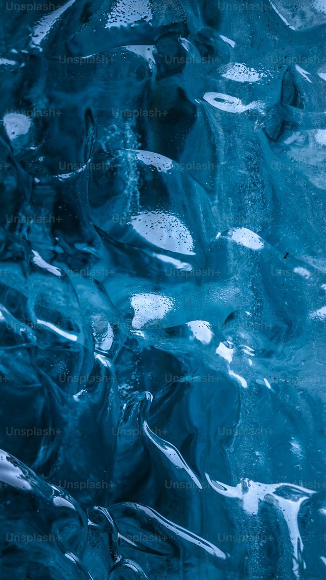1290x2796 a large amount of ice on the side of a mountain -  iPhone Wallpaper