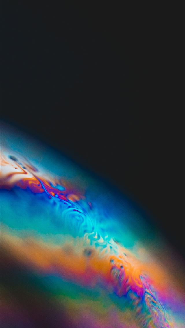 1290x2796 a close up of a colorful object with a black backg... -  iPhone Wallpaper