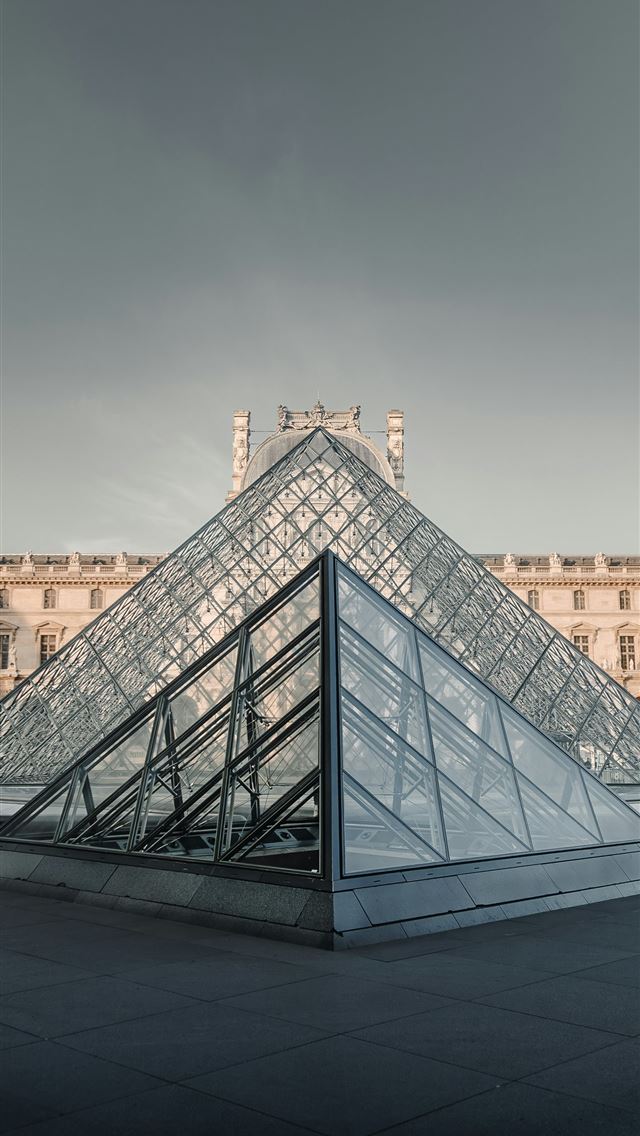 1290x2796 A large building with a glass pyramid in front of ... -  iPhone Wallpaper