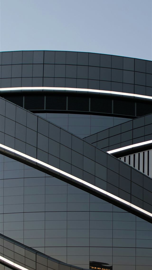 1290x2796 A building with a clock on the side of it -  iPhone Wallpaper