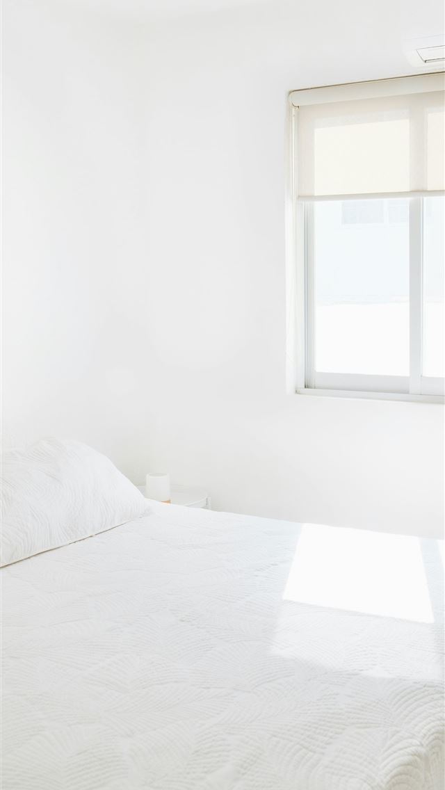 1290x2796 A clean white bedroom with bright sunlight  -  iPhone Wallpaper