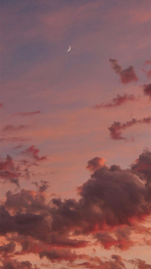 1290x2796 a pink sky with clouds and a half moon -  iPhone Wallpaper