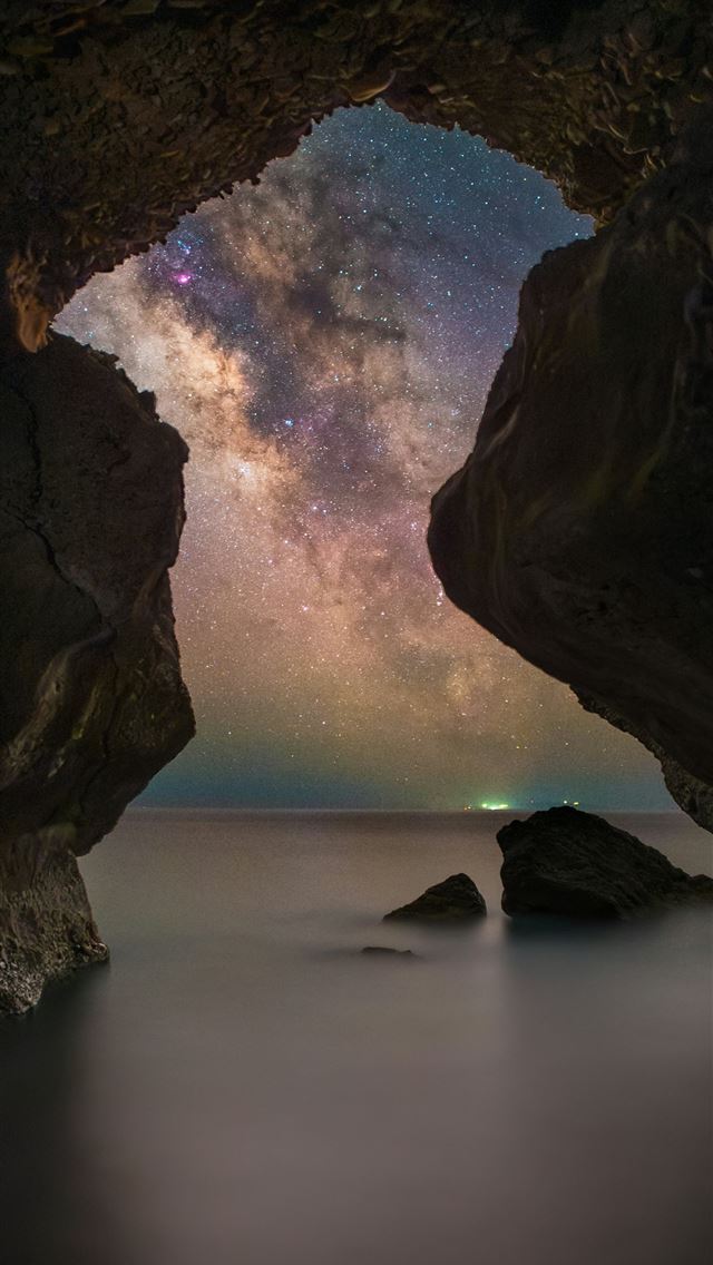 1290x2796 A view of the night sky from inside a cave -  iPhone Wallpaper