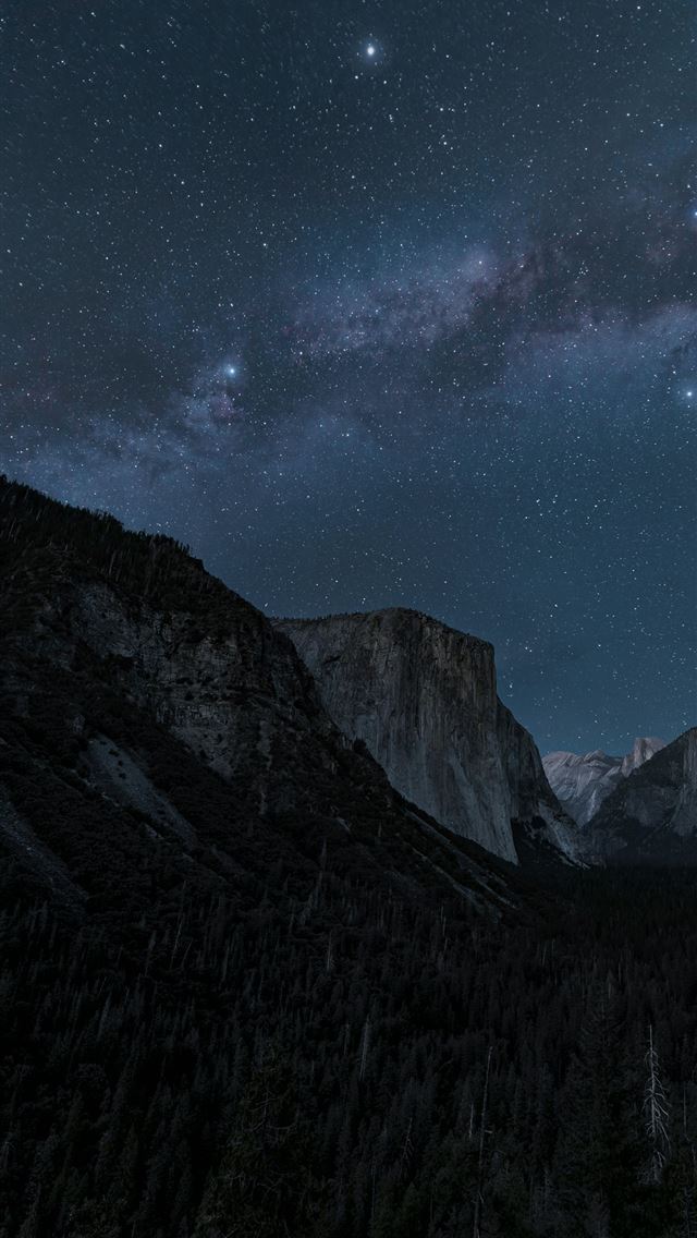 1290x2796 Milky way over mountains and forests at night  -  iPhone Wallpaper
