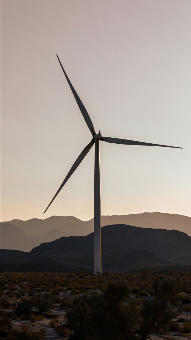 1290x2796 a wind turbine in the middle of a desert -  iPhone Wallpaper