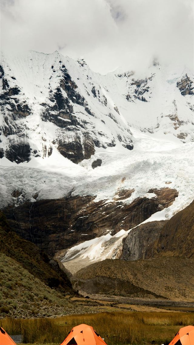 1290x2796 a group of tents set up in front of a snowy mounta... -  iPhone Wallpaper