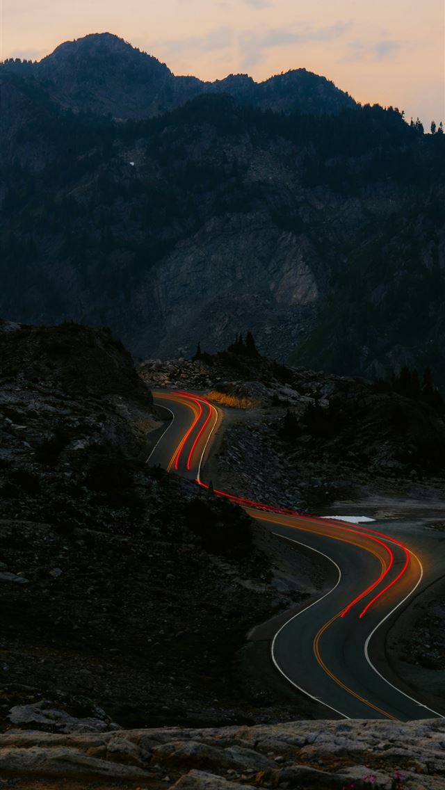 1290x2796 A winding road in the middle of a mountain range -  iPhone Wallpaper