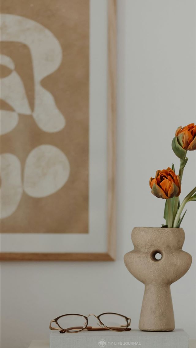1290x2796 a vase with flowers on a table -  iPhone Wallpaper
