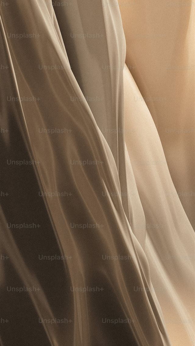 1290x2796 a close up of a cloth with a blurry background -  iPhone Wallpaper