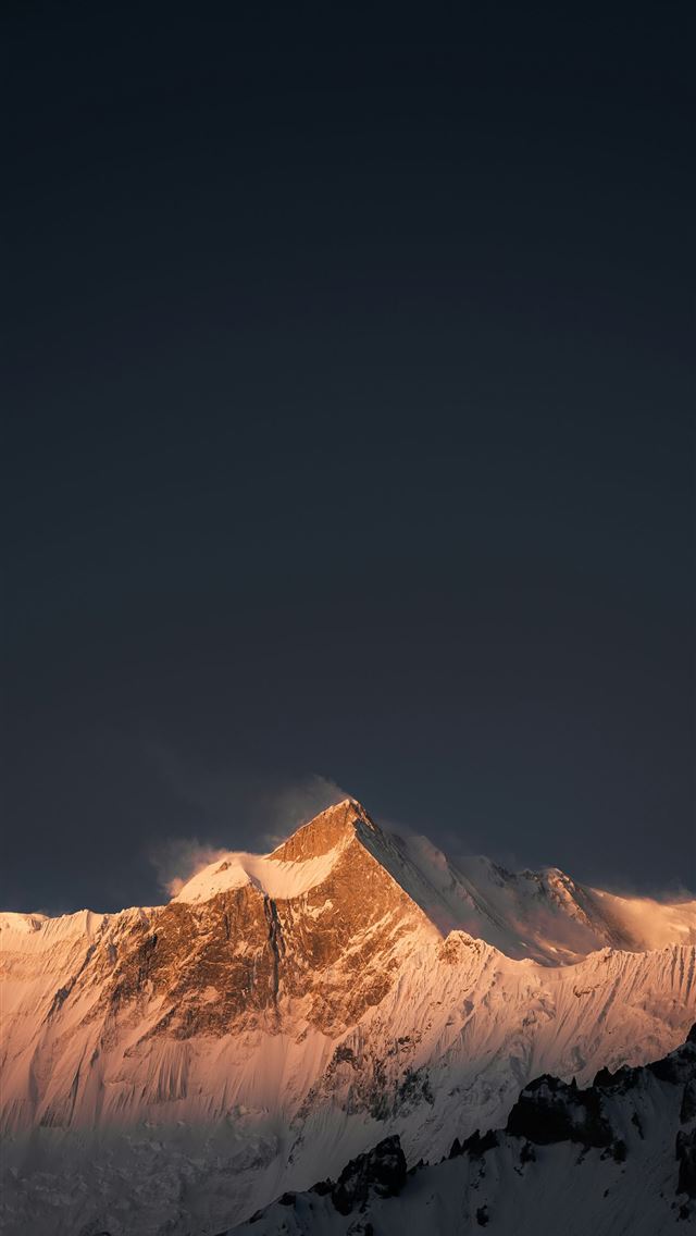 1290x2796 A large mountain covered in snow under a dark sky -  iPhone Wallpaper
