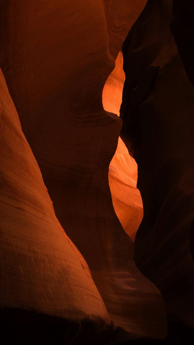 1290x2796 A person standing in a narrow slot in a canyon -  iPhone Wallpaper
