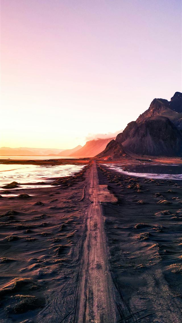 1290x2796 Road leads through landscape at sunset  -  iPhone Wallpaper
