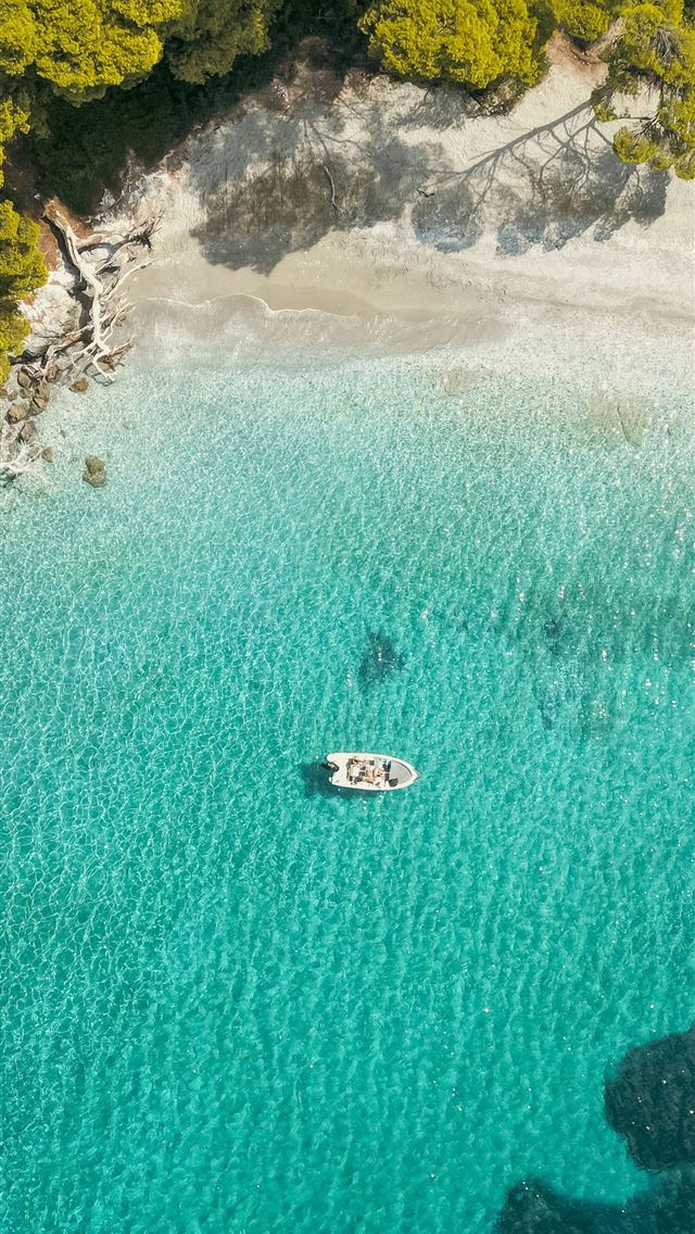 1290x2796 An aerial view of a boat in the water -  iPhone Wallpaper