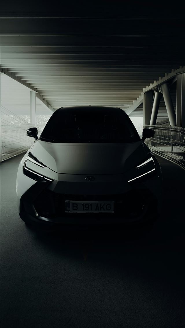 1290x2796 A car driving through a tunnel in the dark -  iPhone Wallpaper