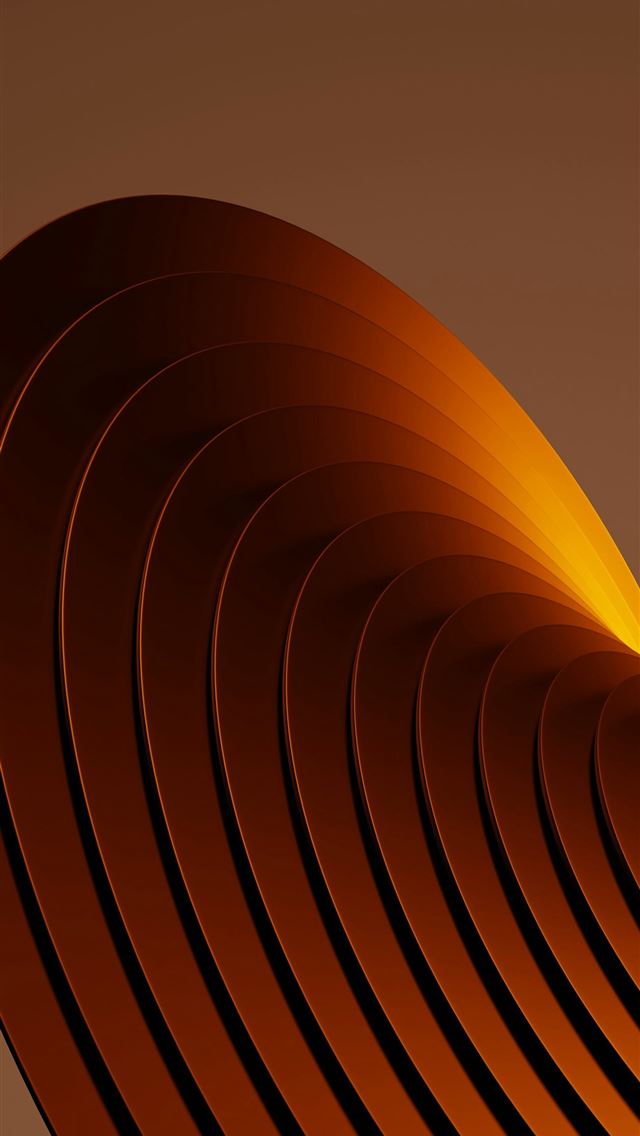 640x1136 a close up of a metal object with a brown backgrou... -  iPhone Wallpaper