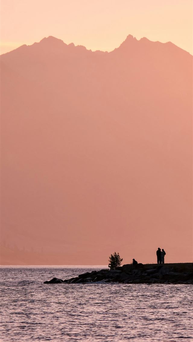 640x1136 A couple of people standing on top of a small isla... -  iPhone Wallpaper
