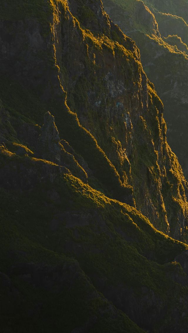 1290x2796 A view of the top of a mountain in the sun -  iPhone Wallpaper