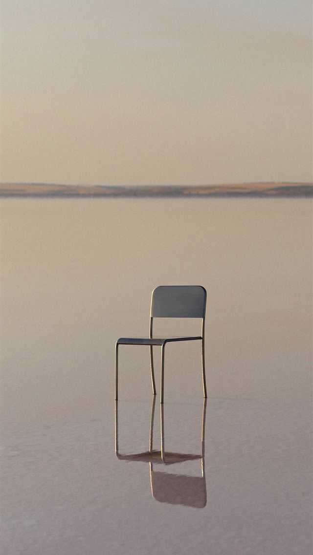 640x1136 A lone chair sits in a shallow body of water  -  iPhone Wallpaper