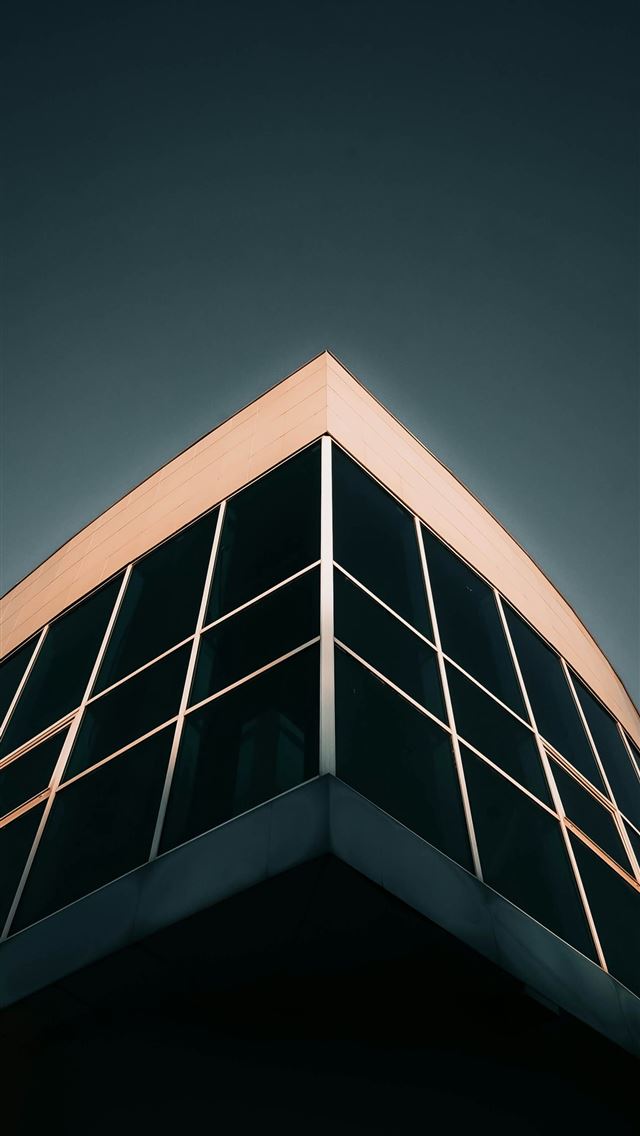 1290x2796 Modern building corner with dark glass windows -  iPhone Wallpaper