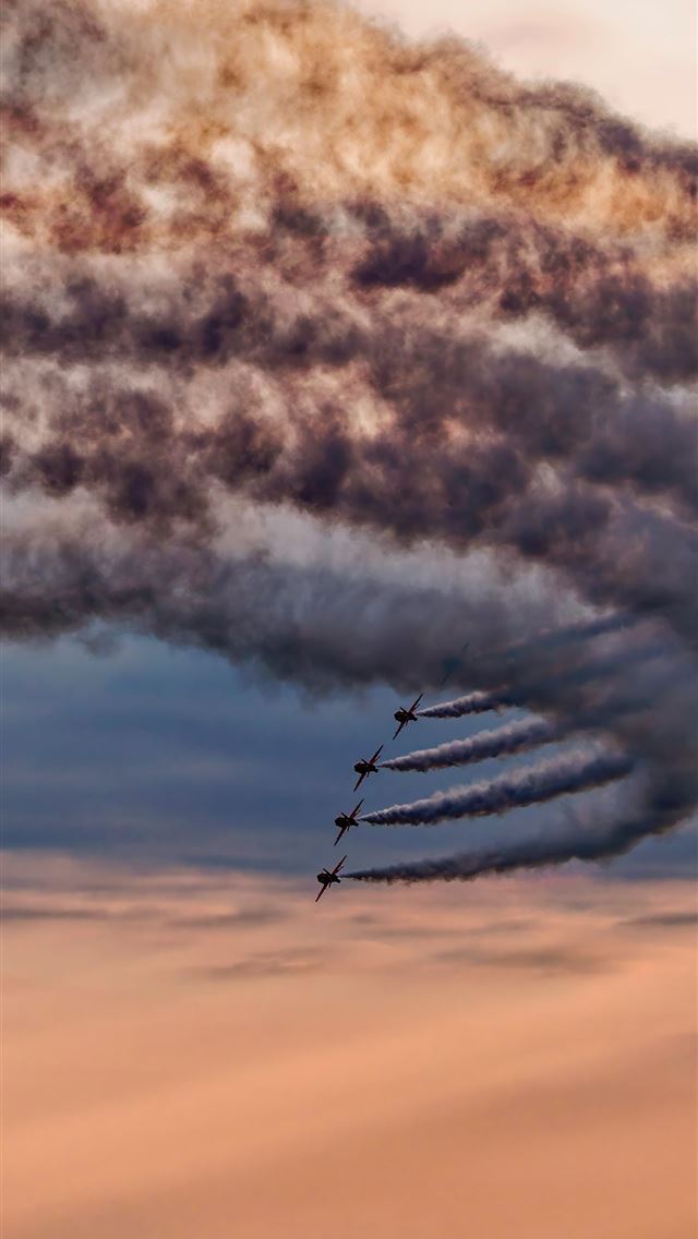 1290x2796 Airplanes create smoke trails in a cloudy sky -  iPhone Wallpaper