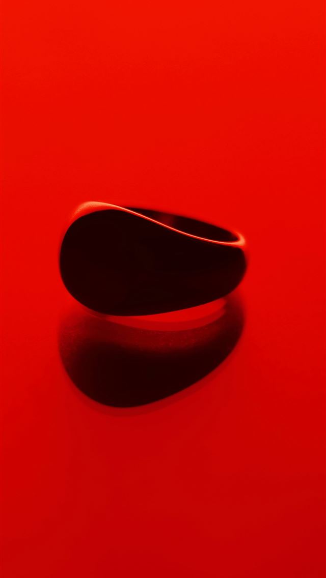 1290x2796 A red surface with a black object on it -  iPhone Wallpaper
