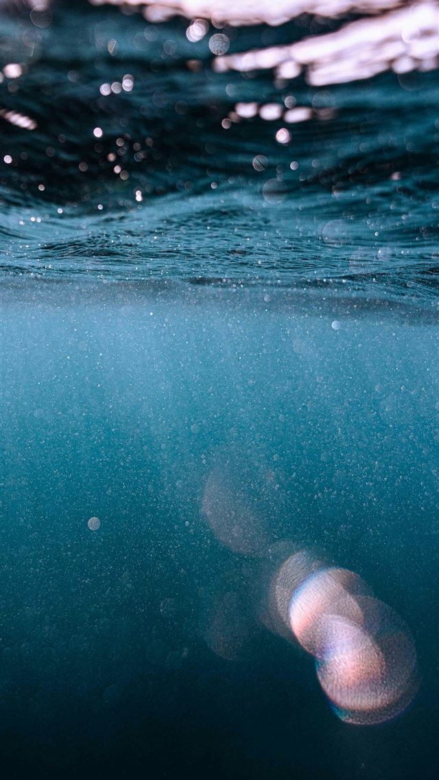 1290x2796 Underwater view with light reflections and bubbles... -  iPhone Wallpaper