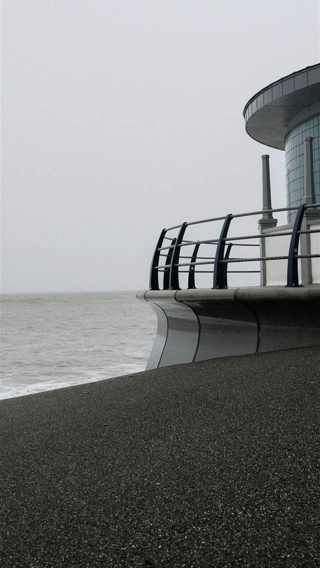 1290x2796 white and black concrete building on white sand be... -  iPhone Wallpaper
