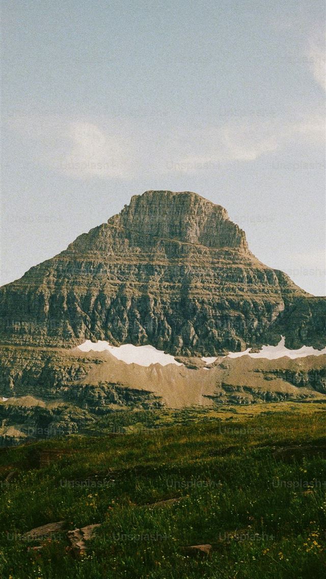 1290x2796 Majestic mountain rises above a green meadow  -  iPhone Wallpaper