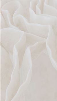 Soft white fabric folds with gentle texture  wallpaper